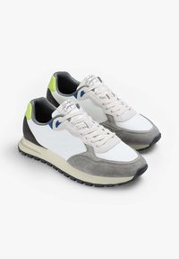 Sneakers featuring a mix of white mesh and grey suede with blue and green accents, rounded toe, flat laces, and textured rubber sole.