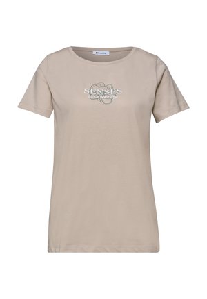 Beige T-shirt med korte ærmer og rund hals, med et blomstermotiv og teksten "SENSES La Vie Boutique" på frontens midte.