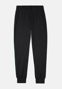 Zwarte sweatpants hebben een elastische tailleband en cuffed hem, met een contrasterende groene zijstripe. Gemaakt van zachte, ademende stof.