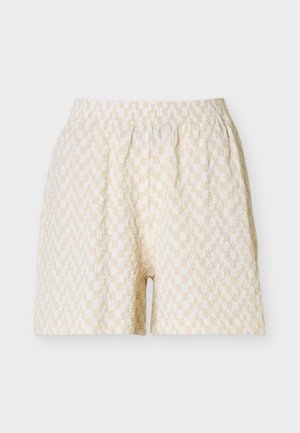 Béžovo-biele kárované krátke nohavice z textúrovaného materiálu s elastickým pásom, položené na bielom pozadí.