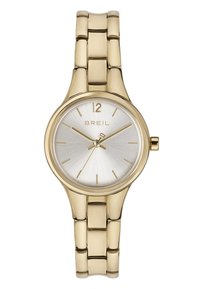 Guldtonet armbåndsur med rund urskive, sølvfarvet skive, minimalistiske timeindikatorer og en sammenkoblet metalrem. Brandlogoet vises.