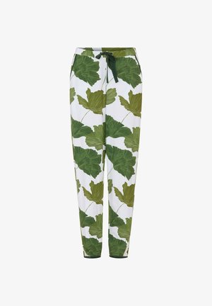 Białe spodnie z troczkami, z dużym zielonym nadrukiem tropikalnych liści i zwężanymi nogawkami, prezentowane na białym tle.