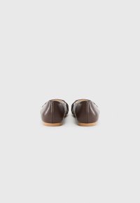 Brown leather ballet flats with a smooth finish, rounded toe, and a soft, flexible sole featuring stitching along the edges.