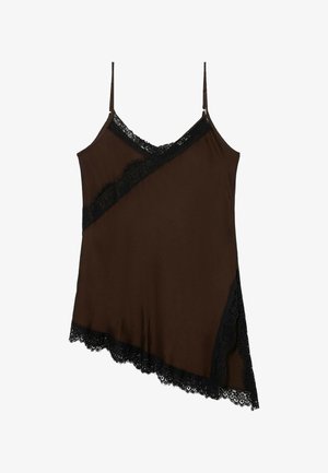 Ruskea toppi mustilla pitsikoristeilla, jossa on diagonaalinen kuvio ja säädettävät olkaimet. Helmassa on aaltoileva pitsireunus.