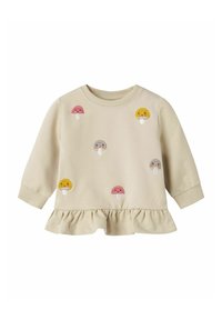 Sweatshirt beige à manches longues avec un ourlet froncé, arborant divers champignons colorés brodés en rose, jaune et gris.