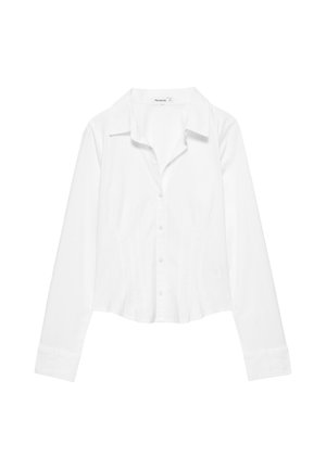 Chemise blanche à manches longues avec col, taille légèrement cintrée et poignets boutonnés, présentée sur fond blanc.