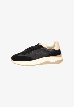 Black sneaker with a mix of suede and leather. Features a cream-colored heel, black laces, a textured side panel, and a beige sole.