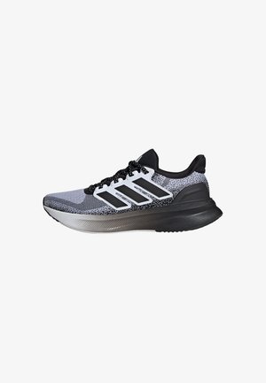 Running shoe in black, white, and gray with a textured mesh upper, sleek silhouette, three black stripes, and cushioned sole.