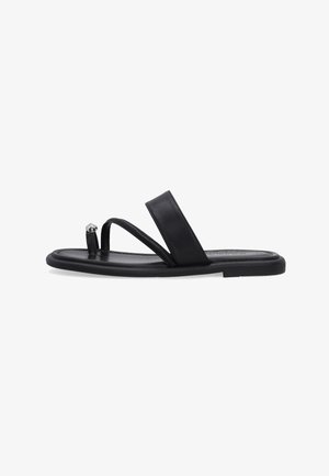 Black flat sandal with a thin toe loop featuring a silver stud and a wider strap over the mid-foot.