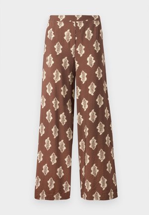 Wide brown pants made of fabric with a textured surface, featuring a repeating leaf pattern in cream color. Elastic waistband.