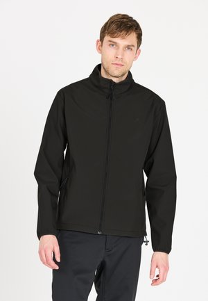 Veste coupe-vent noire, fermeture éclair à l'avant, col montant, deux poches latérales, poignets élastiques, texture lisse, design minimaliste.