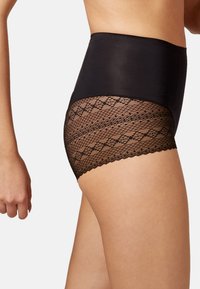 Shapewear noir taille haute avec une partie supérieure lisse et une partie inférieure à motif en dentelle, dotée de bords festonnés et d'une texture transparente.