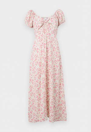 Robe longue crème à motif floral rose, manches bouffantes, encolure froncée et coupe fluide.