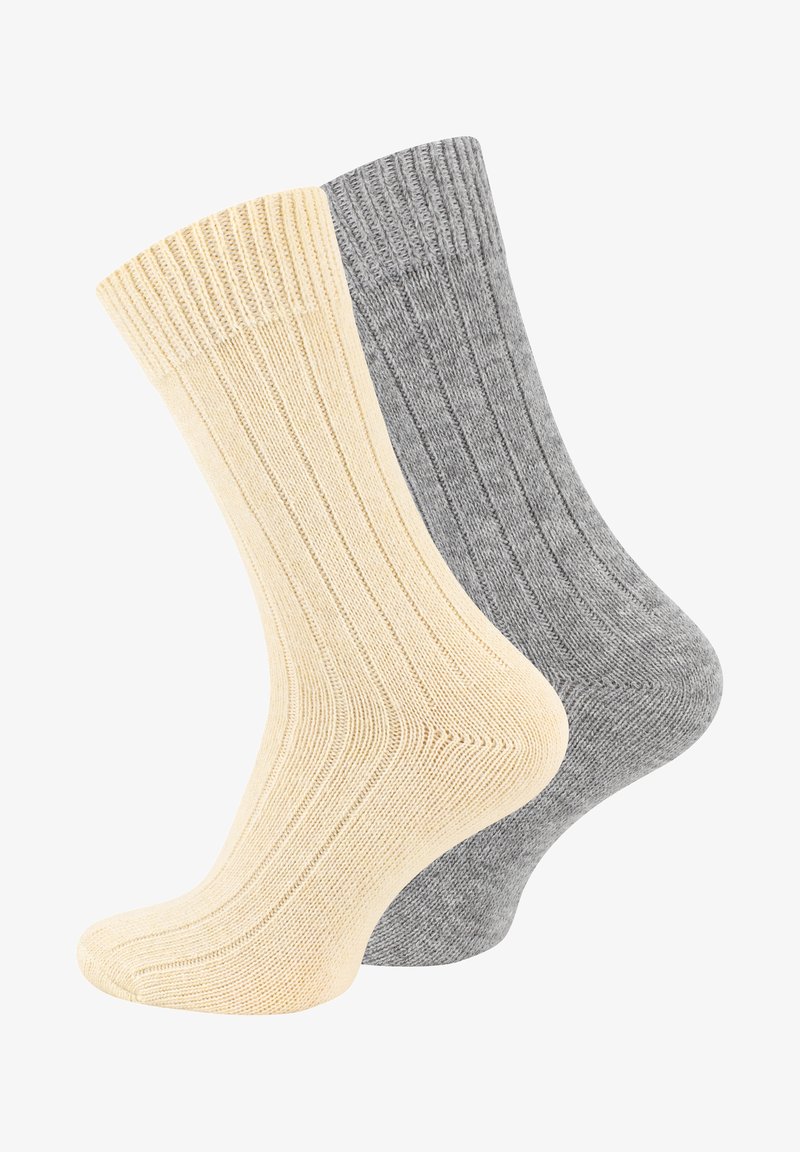 Calze a costine in tonalità beige e grigio. Materiale in misto cotone, lunghezza a metà polpaccio, con una morbida texture e sezioni rinforzate nella punta e nel tallone.