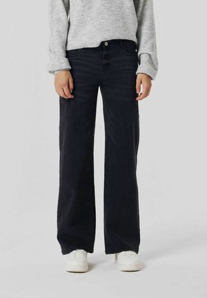 Black wide-leg jeans made of denim, featuring a five-pocket design, front button closure, and a straight silhouette, paired with white sneakers.