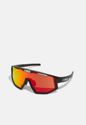 Black sports sunglasses with a geometric design, red and orange mirrored lenses, and prominent branding on the side.