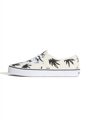 Niskie trampki Vans z białą podstawą, czarnymi wzorami palm, białymi sznurowadłami i grubą białą podeszwą z czarnym paskiem.