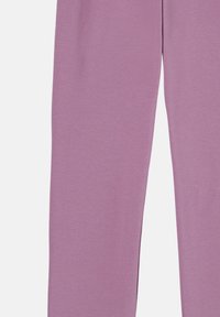 Lilafarbene Leggings aus einem weichen, dehnbaren Baumwollmix. Sie verfügen über eine glatte Textur und ein eng anliegendes Design, das zum Knöchel hin verjüngt.