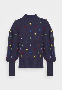 Pull tricoté bleu marine avec un col montant, orné de pompons colorés et manches ballons. Tissu texturé.