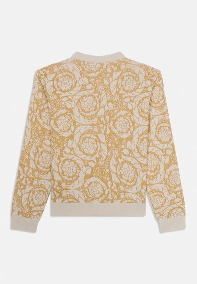Maglione a maglia color crema con un modello floreale dorato testurizzato. Presenta un collo a giro e polsini e orlo a costine.