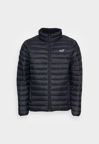 Black puffer jacket with a horizontal quilted design, high collar, full zip closure, and white logo on the left chest.