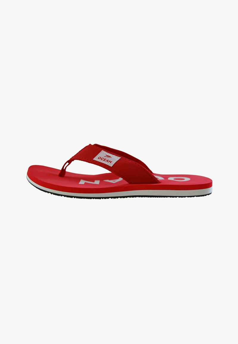 Red flip-flop sandal with white and black sole, fabric strap labeled "OCEAN," viewed from the side on a white background.
