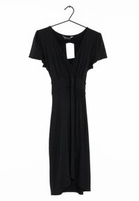 Black dress made of soft fabric, featuring short sleeves, a V-neck, and a wrap design with an uneven hem. Tag visible on hanger.