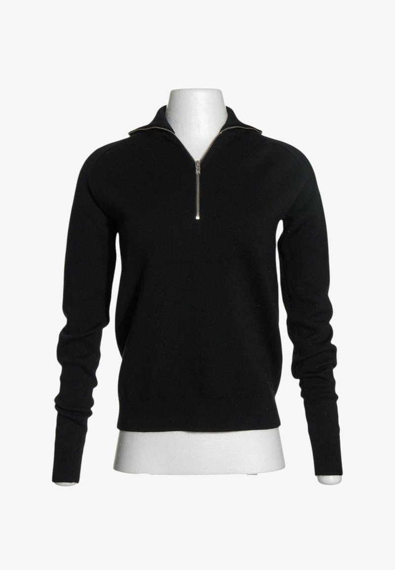 Pull noir à manches longues avec un col zippé à moitié, présenté sur un buste de mannequin blanc sur fond blanc.