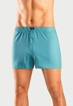 Light blue cotton boxers with an elastic waistband, featuring a button-up fly and two buttons at the front. Smooth texture, casual design.