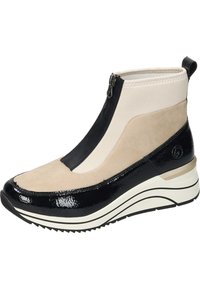 Bottines noires et beige avec fermeture éclair, en matériaux en daim et en cuir verni, à forme effilée et semelle en caoutchouc texturée.