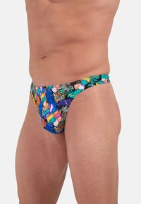 Herren-Schwimmbriefs mit einem lebhaften tropischen Muster in Blau, Grün, Pink und Orange. Hergestellt aus dehnbarem Stoff, im niedrigen Schnitt.