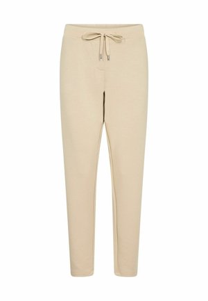 Pantalon de jogging beige en tissu doux, doté d'une taille à cordon, de jambes fuselées, sans motifs ni accents visibles.