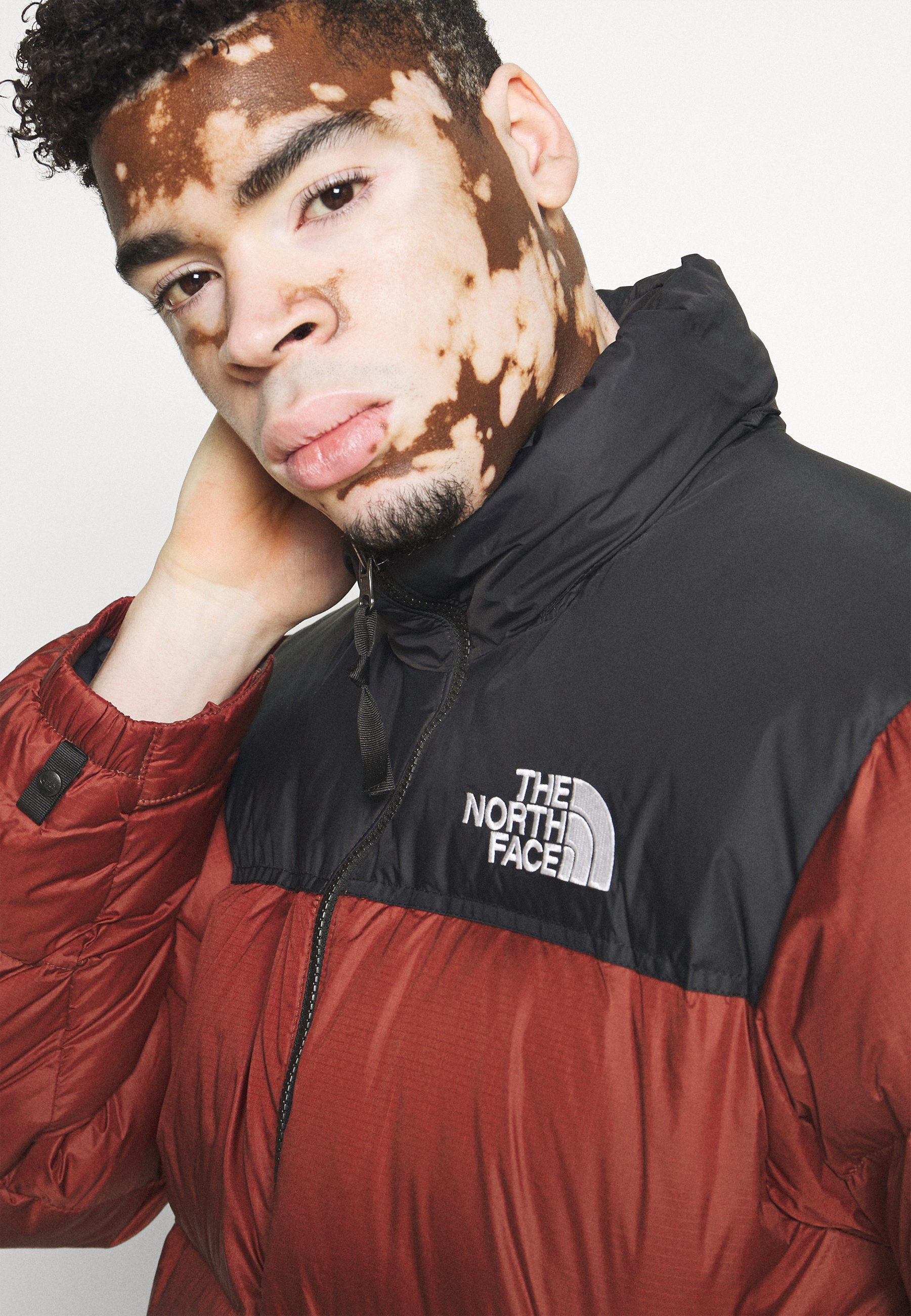 red north face down jacket