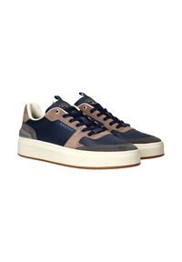 Men's sneakers featuring a navy blue leather and gray suede upper, lace-up design, white midsole, and textured rubber outsole.
