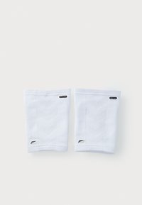 Manchons athlétiques blancs en tissu texturé avec un motif en chevrons. Comprend une étiquette logo et un petit emblème Nike sur le côté.