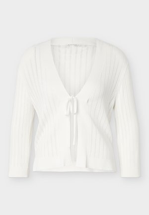 Cardigan en maille blanche à manches longues, rayures verticales ajourées, col en V profond et fermeture à nouer à l'avant.