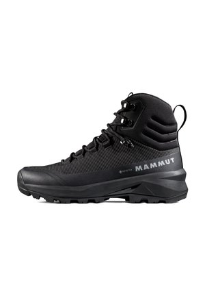 Botte de randonnée Mammut montante noire avec tissu imperméable Gore-Tex, semelle durable et fermeture à lacets, conçue pour une utilisation en plein air robuste.