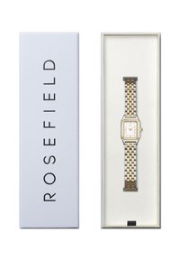 Orologio quadrato con cinturino in metallo dorato e argentato, quadrante bianco, in una scatola blu con il nome del marchio "ROSEFIELD" stampato in nero.