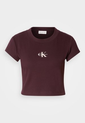 Tricou scurt, de culoare burgundă, din material cu nervuri și cu mâneci scurte. Are un logo alb Calvin Klein centrat pe piept.