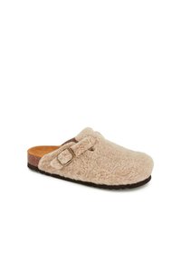 Beige slipper with a fluffy textile upper, adjustable strap with a metal buckle, cork footbed, and textured rubber sole.