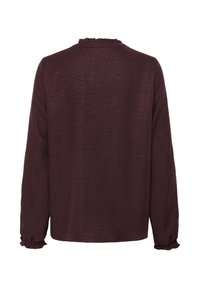 Blusa bordeaux a maniche lunghe con tessuto teksturizzato, scollo arricciato e polsini arricciati. Design semplice e dritto.