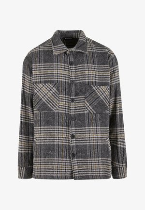 Szürke és fekete kockás ingdzseki gyapjúból, gombos elülső részen, két mellzsebbel és galléros nyakkal.