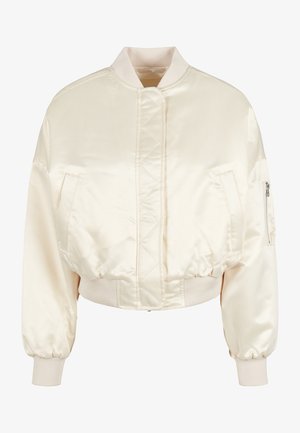 Kreemist satiinist bomber-jakk, millel on tikandiga kujundus, soonikvarrukad ja vöökoht ning kahe esifliisi ja ühe tõmblukuga tasku varrukal.