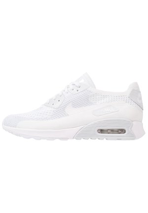 Baskets Nike Air Max entièrement blanches avec tige en mesh, coussin d'air visible dans la semelle et logo classique sur le côté et le talon.