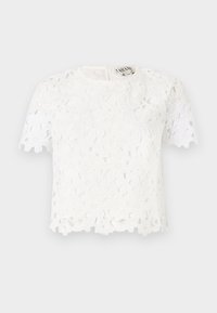 Top bianco in pizzo con motivi floreali, maniche corte, scollatura rotonda e orlo ondulato discreto. Si chiude con una cerniera nella parte posteriore.