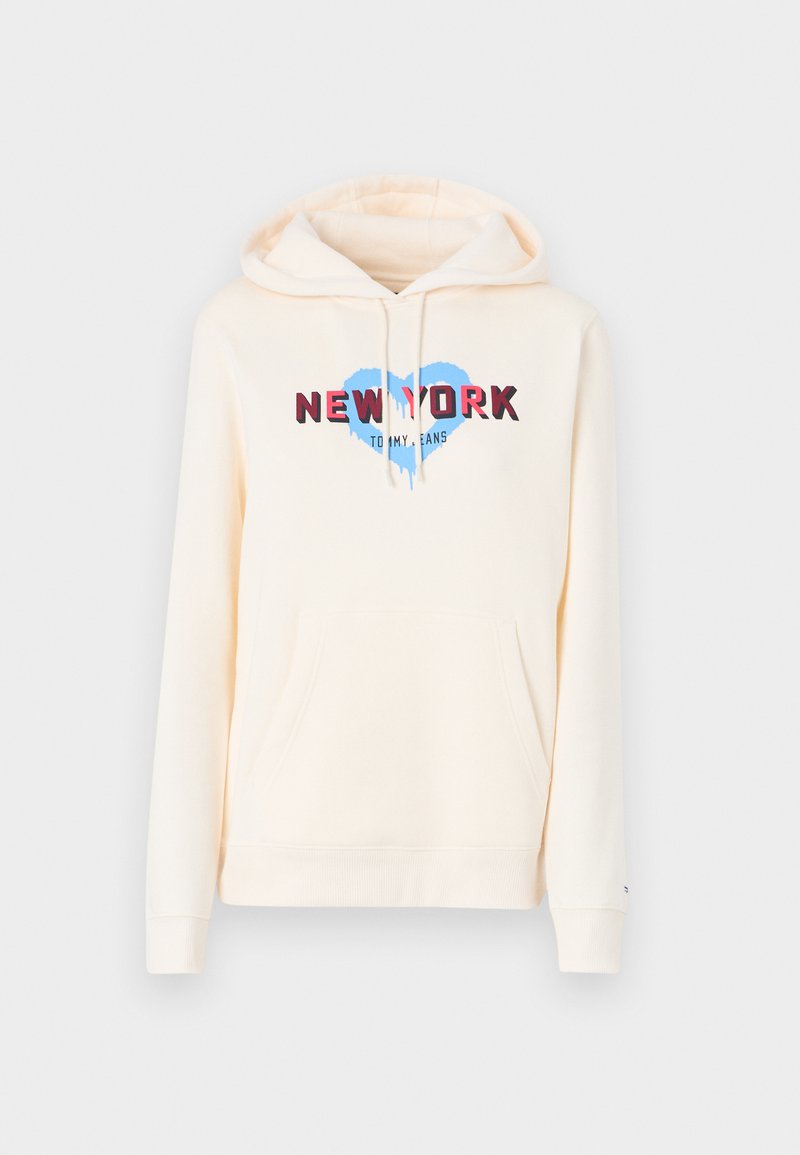 Cremefarbener Kapuzenpulli mit einer frontalen Kängurutasche, ausgestattet mit einem blauen Herz-Grafik und dem Text "NEW YORK" in Rot. Der Stoff wirkt weich und lässig.
