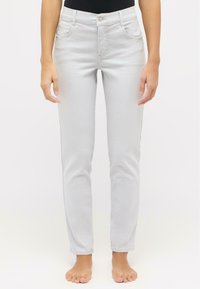 Light gray jeans with a slim fit, five-pocket design, and button closure. Visible stitching and subtle texture enhance the fabric.