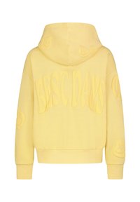 Gelbe Kapuzenjacke mit einem strukturierten "BEST DAYS"-Druck über den Rücken, verziert mit verspielten Patches an den Ärmeln und einer Kordelzugkapuze.