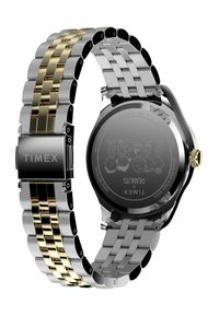 Silver and gold-toned stainless steel watch with a two-tone band, round black face, and engraved back. Features a metallic clasp.