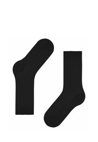 Svarta ribbade strumpor med en slät yta, som har förstärkta tår och mudd för ökad hållbarhet. Standard ankellängd design.